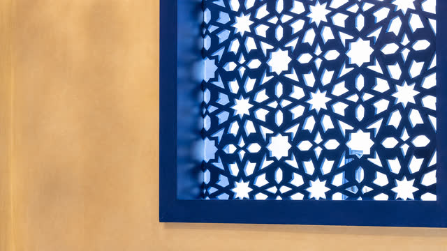 A blue mashrabiya that filters the light into stars.