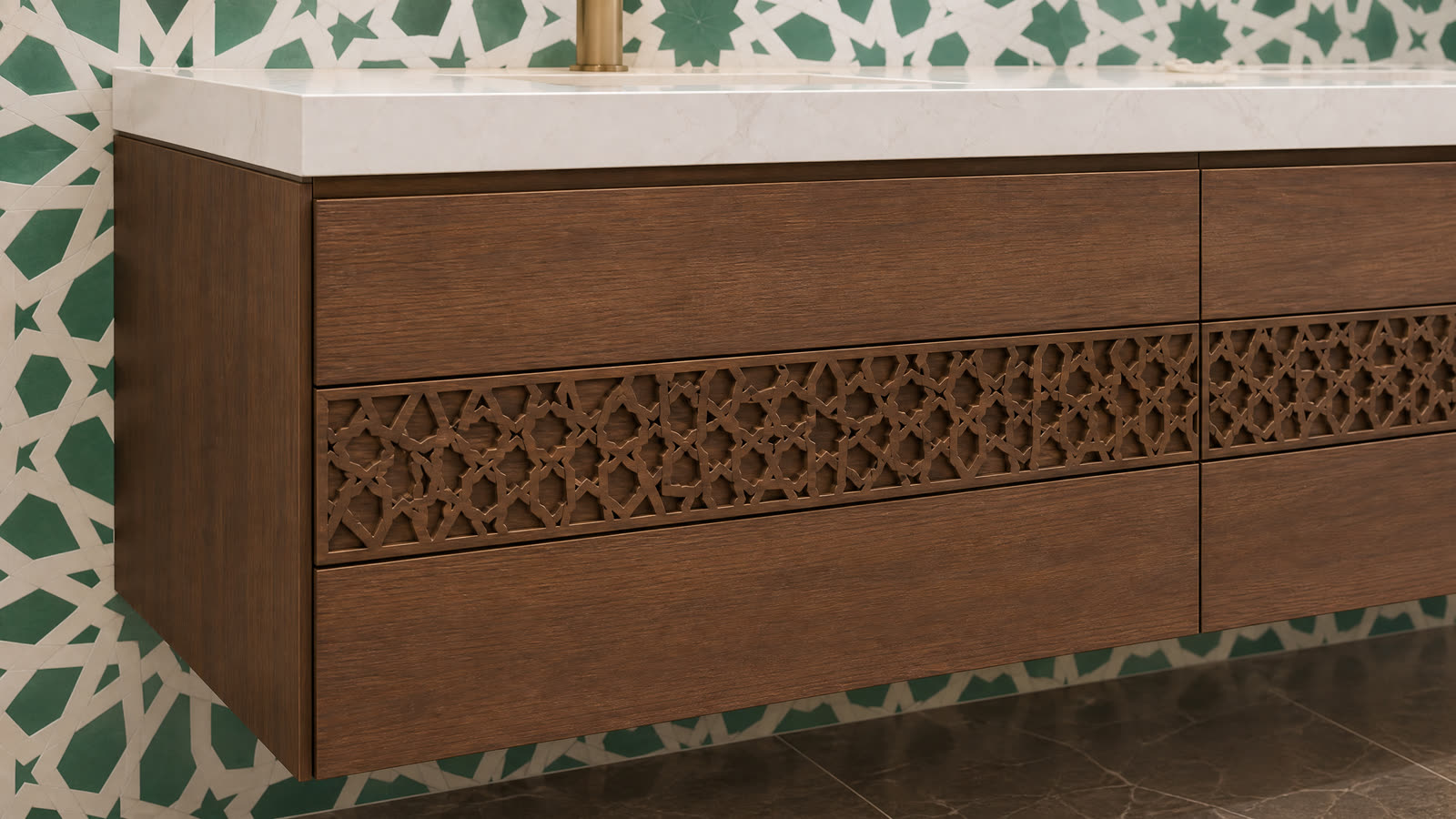 A green and white zellige mosaic wall behind a floating wood vanity.