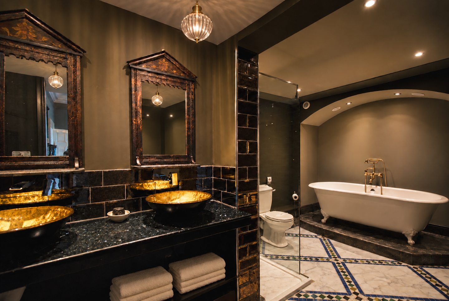 Oriental bathroom with gold basins, carved mirrors and a marble and zellige floor