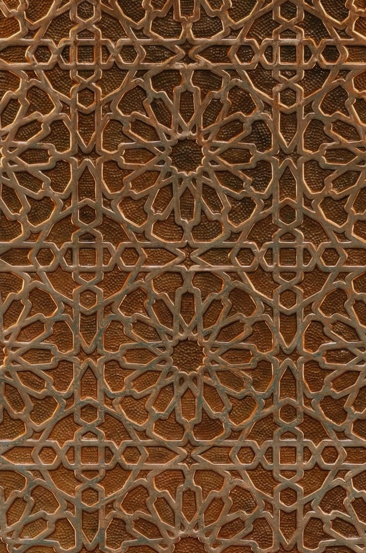Carved wooden panel with geometric patterns