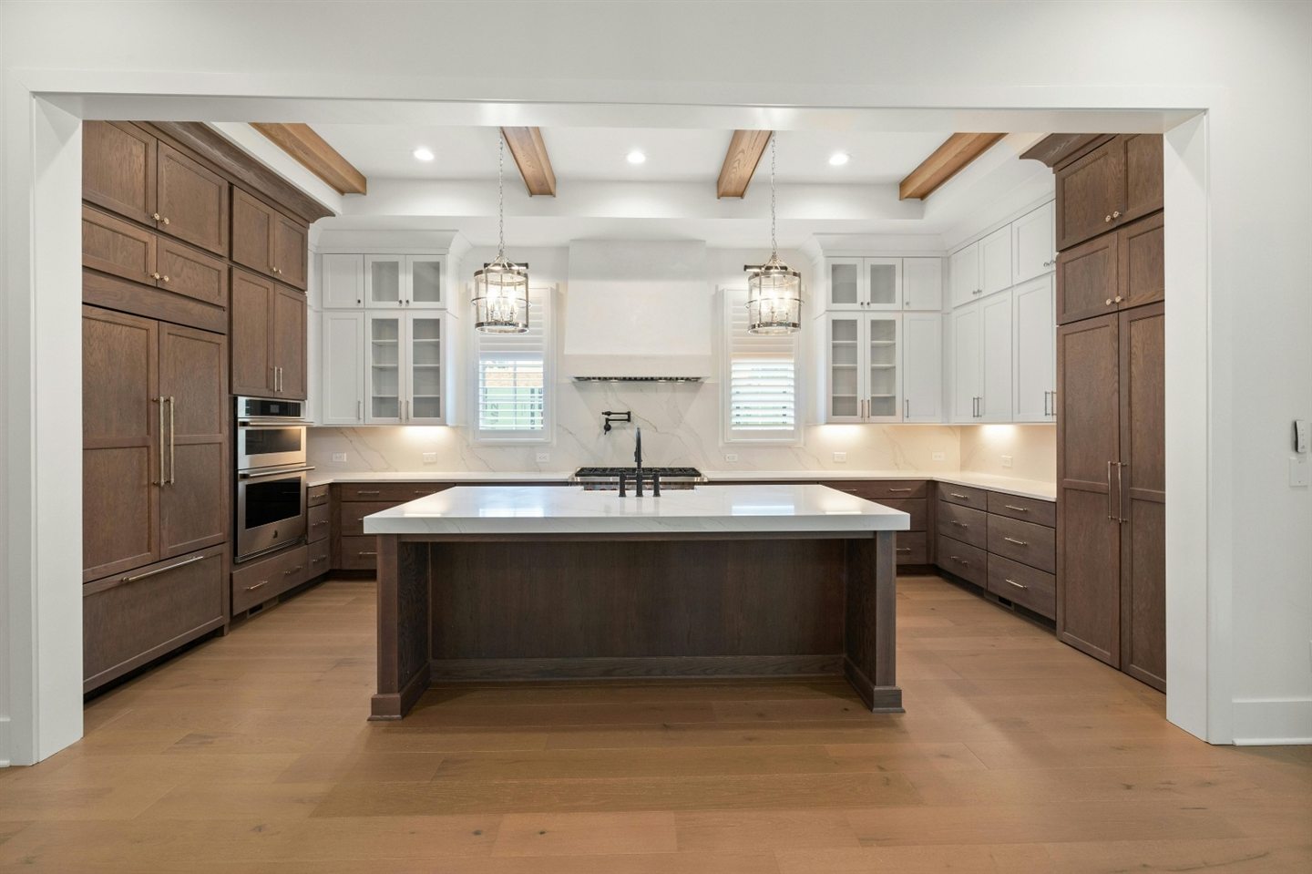 Kitchen with wooden cabinets and a high ceiling