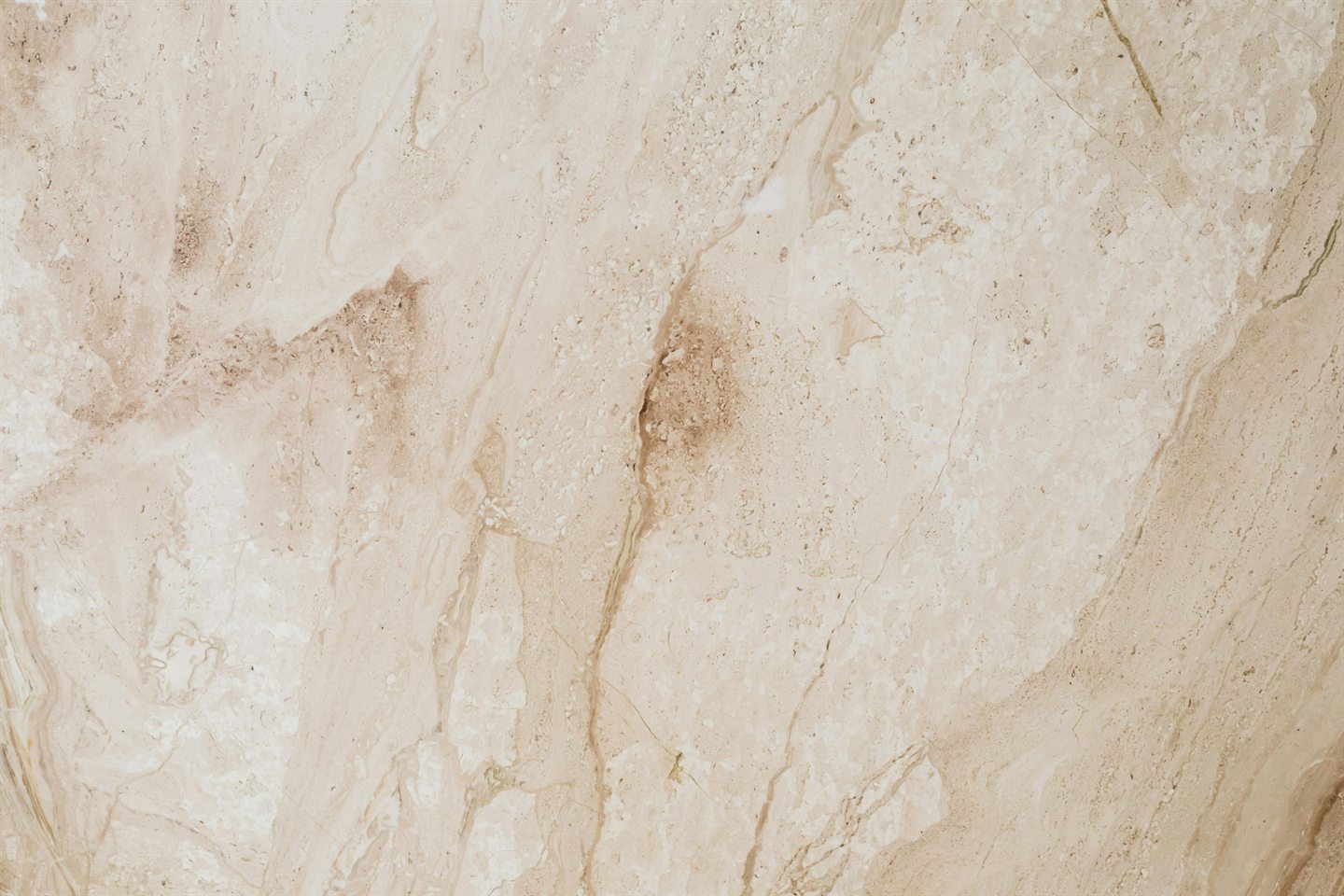 Texture de marbre beige aux veines dorées