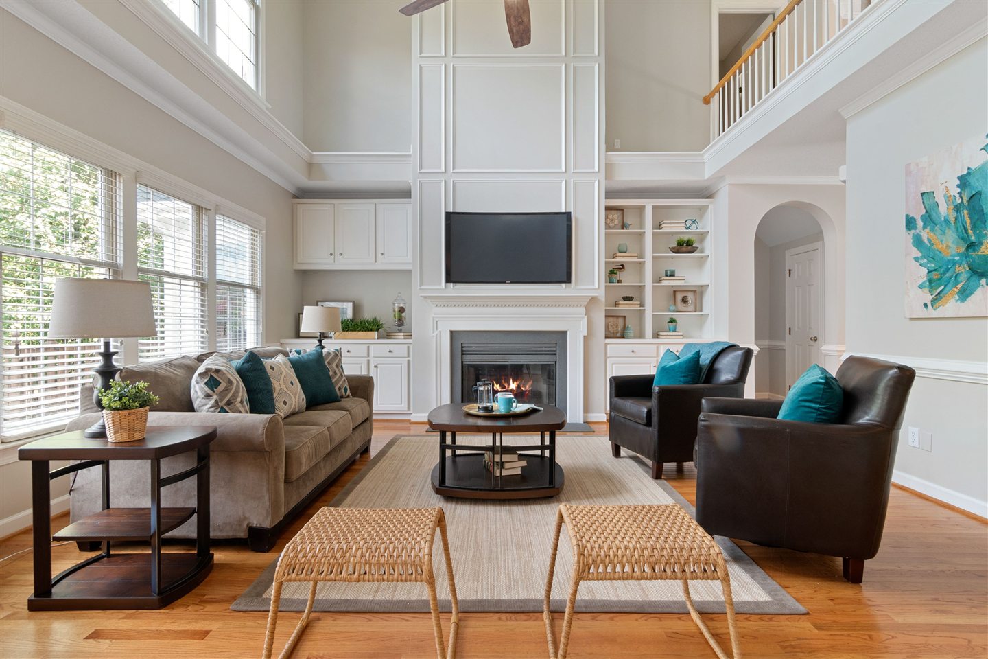 Bright living room with sofas, coffee table and fireplace