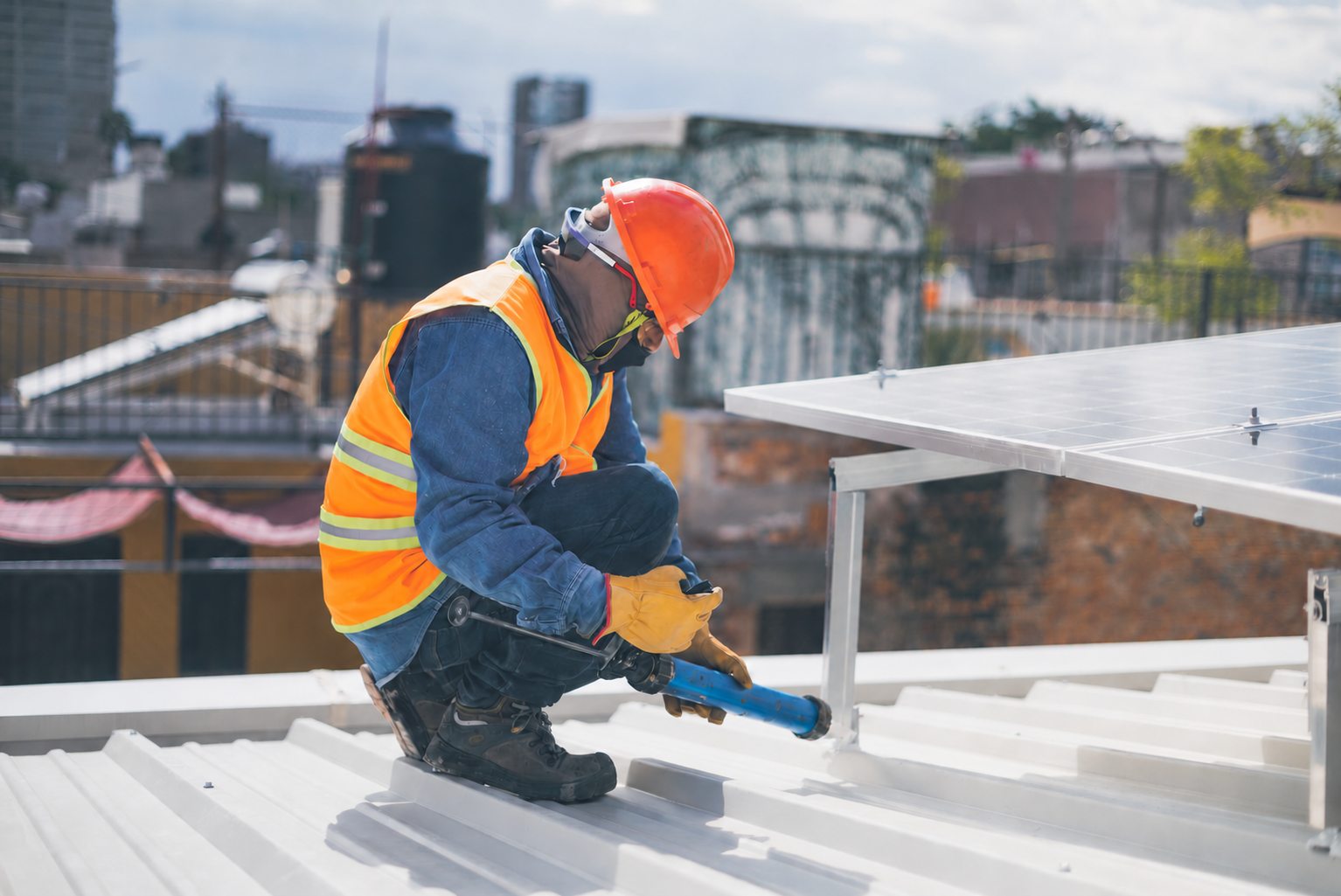 Installing insulation panels on a roof